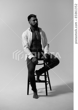 Muscular shirtless tattooed guy in studio 85861352