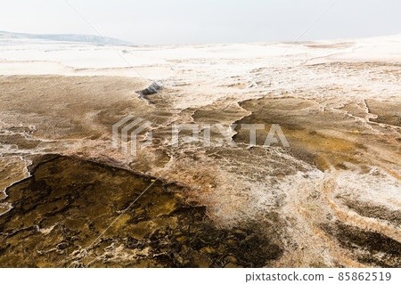 White travertine formations at hot springs of Pamukkale, Turkey White travertine formations at hot springs of Pamukkale, Turkey 85862519