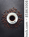 Coffe cup with saucer and beans 85863008