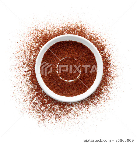 Coffee powder with saucer on white background 85863009