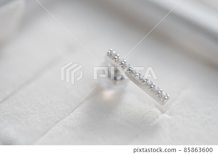 Macro shot of pierced earrings with diamonds Macro shot of pierced earrings with diamonds 85863600