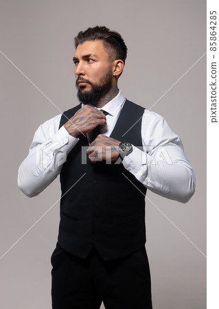 Tattooed male model in formal clothes with tie Tattooed male model in formal clothes with tie 85864285