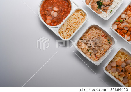 Top view various instant frozen food in packaging on white background with copy space. 85864430