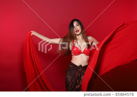Young Slim Transgender Asian Woman wears red bikini bra dress, Beautiful Girl fluttering fabric 85864578