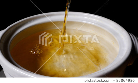 Dashi stock in a clay pot Dashi stock in a clay pot 85864986