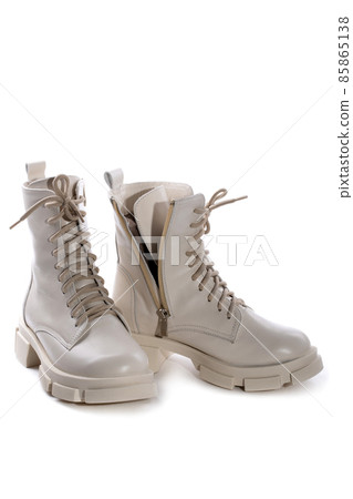 Female winter boots on high soles on a white background 85865138