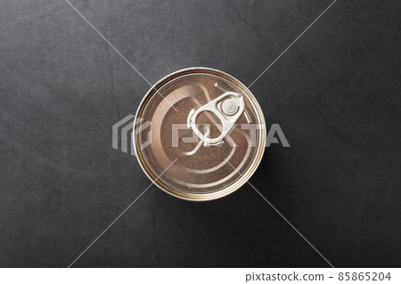 A can with a metal lid and a ring for opening 85865204