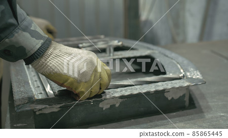 Forge workshop on table. Smithy manual production. Work on the product. Ruler, angle grinder. The blacksmith manufacture of fireplaces, stoves. Forge workshop on table. Smithy manual production. Work on the product. Ruler, angle grinder. The blacksmith manufacture of fireplaces, stoves. 85865445