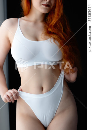 Seductive woman in lingerie at home Seductive woman in lingerie at home 85865634