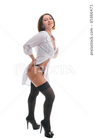 Sexually doctor woman on isolated white background. Caucasian woman medic with big syringe with a red liquid. Sexually doctor woman on isolated white background. Caucasian woman medic with big syringe with a red liquid. 85866471