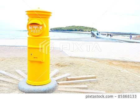 Yellow post, sea and sandy beach 85868133