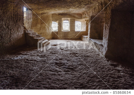 Inside of cave room in cave city Chufut-Kale in Bakhchysarai, Crimea Inside of cave room in cave city Chufut-Kale in Bakhchysarai, Crimea 85868634