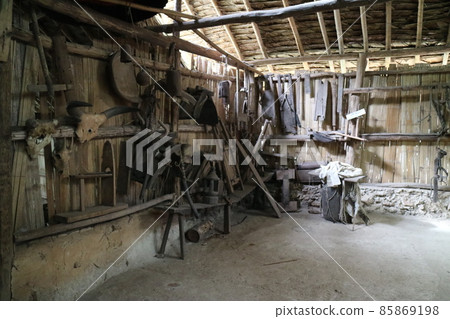 Old traditional old warehouse piled with minnows and hats. Agricultural supplies 85869198