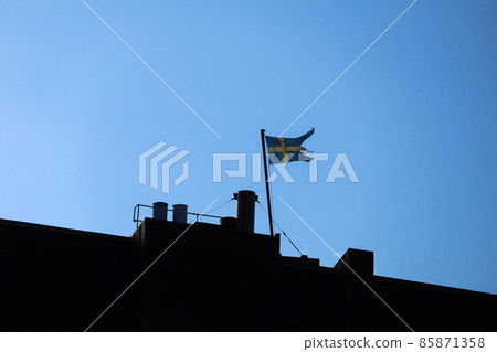 Swedish flag fluttering in the blue sky Swedish flag fluttering in the blue sky 85871358