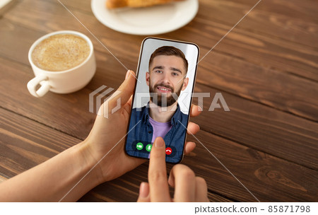 Cropped of woman having video conference with bearded man Cropped of woman having video conference with bearded man 85871798