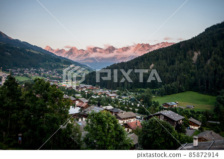 Sunset on The Grand-Bornand village and the Aravis mountain range 85872914