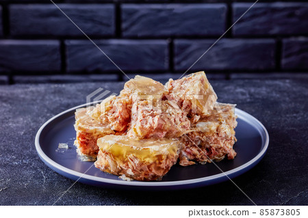 meat aspic, jellied slow cooked meat on a plate meat aspic, jellied slow cooked meat on a plate 85873805