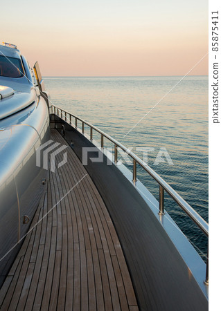 Beautiful sea view from the starboard side of a luxury yacht at sunset / sunrise - vertical orientation Beautiful sea view from the starboard side of a luxury yacht at sunset / sunrise - vertical orientation 85875411