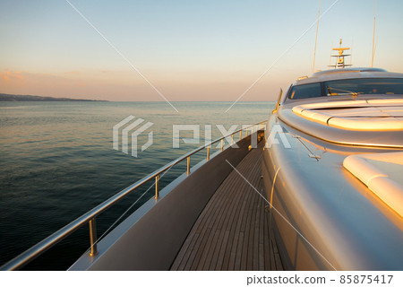 Beautiful sea view from the left board side of a luxury yacht at sunset / sunrise - horizontal orientation 85875417