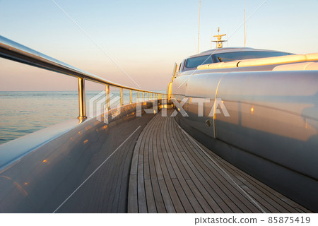 Beautiful sea view from the left board side of a luxury yacht at sunset / sunrise - horizontal orientation 85875419