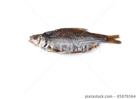 One jerky or dried salted roach, delicious clipfish isolated on white background. Salty beer appetizer. Traditional way of preserving fish. Close up 85876564