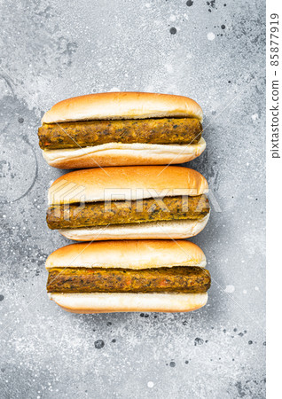 Vegan hot dog with meatless Vegetarian sausage. Gray background. Top view 85877919