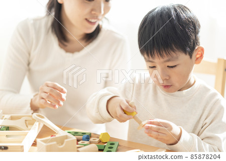 Parent and child playing with blocks Parent and child playing with blocks 85878204