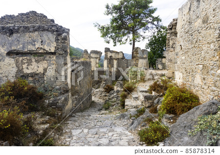 Landmark of Turkey. The abandoned old Greek city of Kayakoy on the Lycian Trail. 85878314