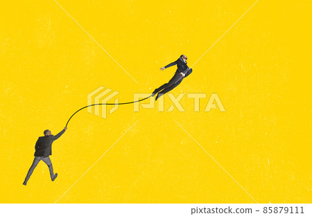 Contemporary art collage. Man holding one flying businessman symbolizing new ideas, motivation and growth Contemporary art collage. Man holding one flying businessman symbolizing new ideas, motivation and growth 85879111
