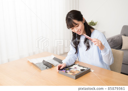 A woman who shoots a lunch box with a smartphone A woman who shoots a lunch box with a smartphone 85879361
