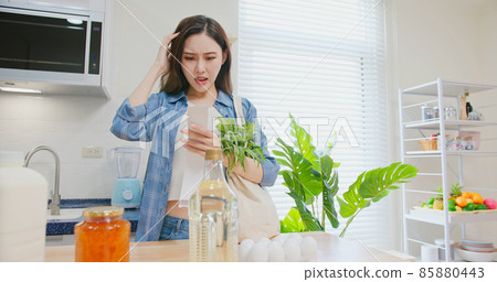 woman look at shopping bills woman look at shopping bills 85880443