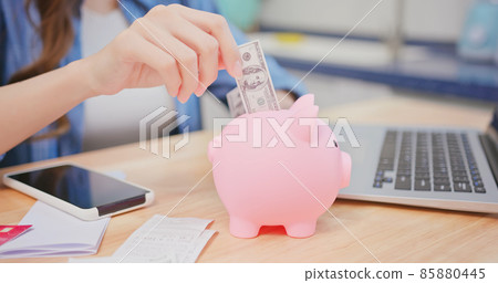 put money into piggy bank put money into piggy bank 85880445