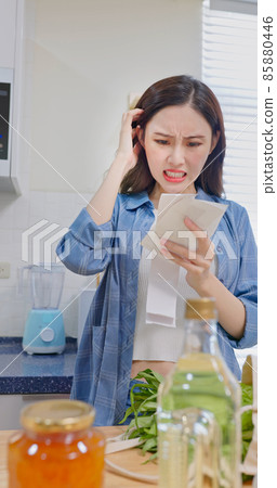 woman look at shopping bills woman look at shopping bills 85880446