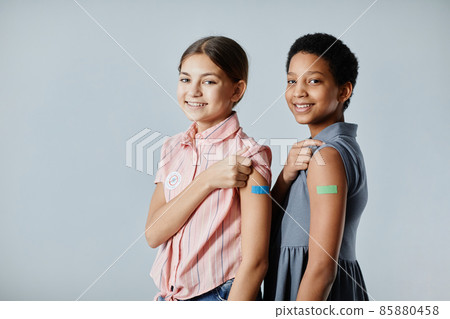 Girls with Vaccine Plaster Girls with Vaccine Plaster 85880458