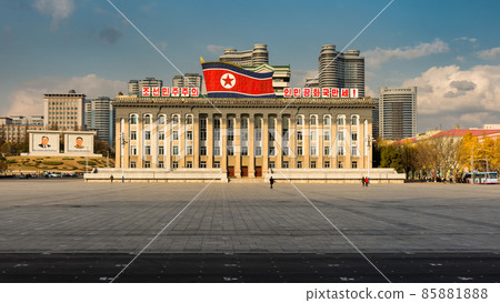Kim Il-sung Square and government building decorated with huge flag of North Korea Kim Il-sung Square and government building decorated with huge flag of North Korea 85881888