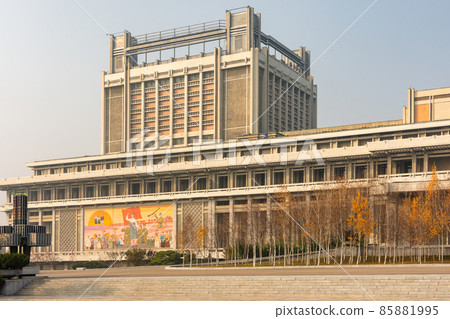 Building decorated with revolutionary symbols and slogans in Pyongyang, North Korea 85881995