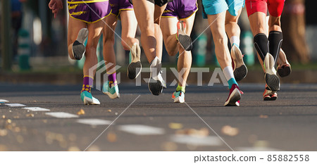 Marathon runners running on city road, large group of runners 85882558