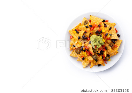 Mexican nachos tortilla chips with black beans, guacamole, tomato and jalapeno Mexican nachos tortilla chips with black beans, guacamole, tomato and jalapeno 85885168