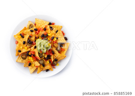 Mexican nachos tortilla chips with black beans, guacamole, tomato and jalapeno Mexican nachos tortilla chips with black beans, guacamole, tomato and jalapeno 85885169