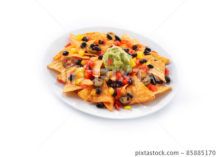 Mexican nachos tortilla chips with black beans, guacamole, tomato and jalapeno Mexican nachos tortilla chips with black beans, guacamole, tomato and jalapeno 85885170