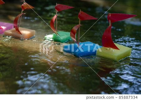 Children's ships in the summer river. Children's ships in the summer river. 85887334