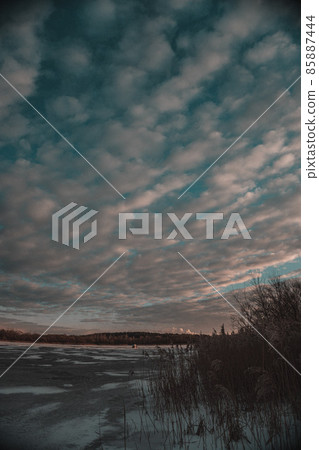 Winter sunset. Frozen Lake. Blue sky. Beautiful melancholy nature. 85887444