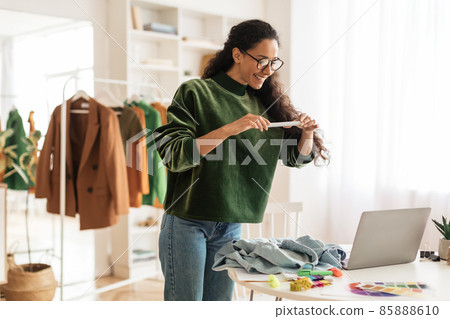 Female Fashion Blogger Taking Photo Of Garment On Phone Indoor Female Fashion Blogger Taking Photo Of Garment On Phone Indoor 85888610