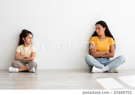 Mother Daughter Conflicts. Offended Little Girl And Mom Sitting Apart On Floor 85888702