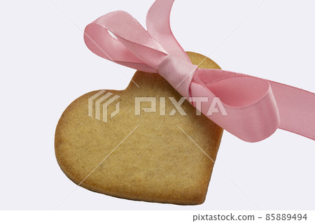 heart shaped cookie purple ribbon white background. Valentine Day, greeting card, pastry, Copy space, top view, love concept, Engagement, horizontal, valentine holiday february 14 85889494