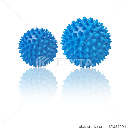 Two blue spiny massage balls isolated on white. Concept of physiotherapy or fitness. Closeup of a colorful rubber ball for dog teeth on a white color background. Corona virus model. Snowflake. 85889694