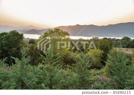Polyfytos artificial lake sunset in Greece. 85890215