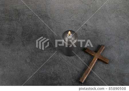 Catholic Cross with burning candle. Ash Wednesday, Lent season, Holy Week, Good Friday and Palm Sunday concept.  85890508