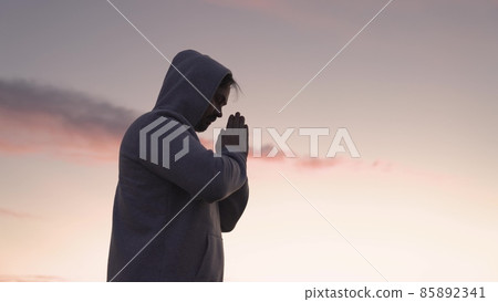 man praying on a pink sky background, believe in good good, ask for help, dream looking up, motivation inspiration outdoors, woman thinks meditating, wanderlust concept, heavenly light man praying on a pink sky background, believe in good good, ask for help, dream looking up, motivation inspiration outdoors, woman thinks meditating, wanderlust concept, heavenly light 85892341