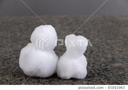 Two small snowmen. Two small snowmen. 85892963